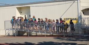 students entering cottage