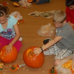 Students carving pumpkins