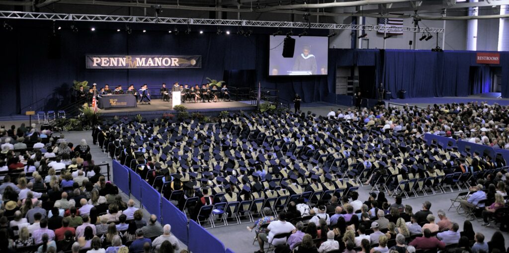 Photo of ceremony showing hundreds of students and guests.
